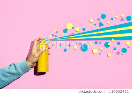 Street artist hand with spray paint can spraying blue and yellow graffiti in different sizes and shapes Street artist hand with spray paint can spraying blue and yellow graffiti in different sizes and shapes 116632801