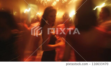Blurred image of woman dancing at party, surrounded by people and warm, glowing lights. The motion blur creates dynamic, energetic atmosphere, highlighting the lively and vibrant mood of the event. Blurred image of woman dancing at party, surrounded by people and warm, glowing lights. The motion blur creates dynamic, energetic atmosphere, highlighting the lively and vibrant mood of the event. 116633470