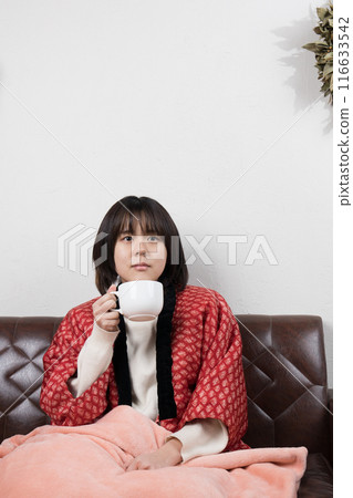 Winter woman relaxing in a room 116633542