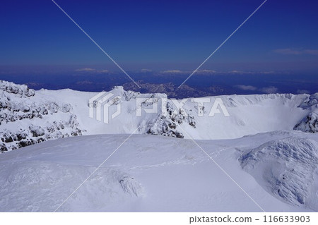 Gassan and the Asahi mountain range from the summit of Mt. Chokai in winter Gassan and the Asahi mountain range from the summit of Mt. Chokai in winter 116633903