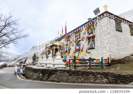 Hikers in Changping valley Sichuan China to appreciate the four sisters mountains would pass through the Lama Temple Hikers in Changping valley Sichuan China to appreciate the four sisters mountains would pass through the Lama Temple 116634194