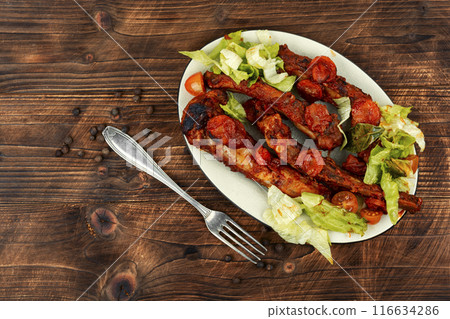 Delicious stewed pork ribs in sauce. 116634286