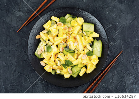 Ananas and cucumber salad. 116634287