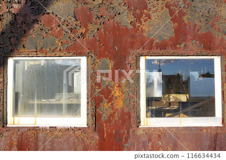 The former Aikoku Station is now an abandoned railway station. A rusty abandoned train car, Yo 4353, outside window of the caboose. 116634434