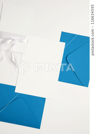 Composition with envelopes and blank cards. Invitation to a celebration, handwritten response to a gift. Top view, copy space, flatlay Composition with envelopes and blank cards. Invitation to a celebration, handwritten response to a gift. Top view, copy space, flatlay 116634595