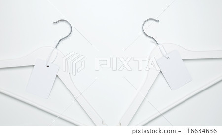Creative flat lay hangers with white paper label. Clothing tag, label blank mockup template. Sale discount store promo shopping concept. Top view. Copy space 116634636