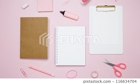 Creative flat lay mockup design of workspace. Top view composition with white notebook, to do list and stationery on pink background 116634704