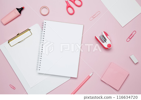 Creative flat lay mockup design of workspace. Top view composition with white notebook, to do list and stationery on pink background Creative flat lay mockup design of workspace. Top view composition with white notebook, to do list and stationery on pink background 116634720