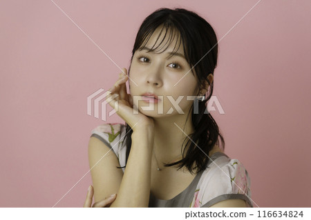 Portrait of a young woman on a pink background Portrait of a young woman on a pink background 116634824