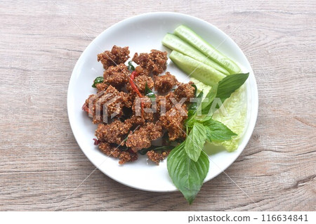 deep fried spicy mashed pork salad eat couple with fresh vegetable on plate 116634841