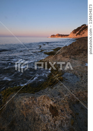 seascape rocky beach at sunset seascape rocky beach at sunset 116634873