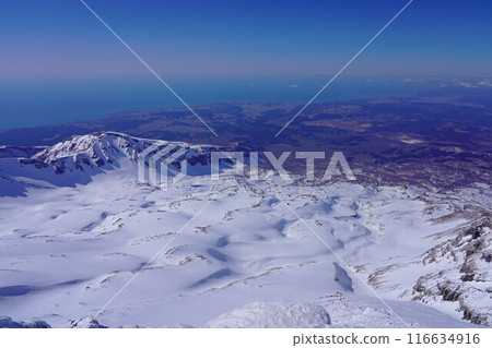 Snow fields, Mt. Inakura and the Sea of Japan from the summit of Mt. Chokai in winter Snow fields, Mt. Inakura and the Sea of Japan from the summit of Mt. Chokai in winter 116634916