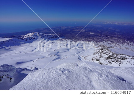 Snow fields, Mt. Inakura and the Sea of Japan from the summit of Mt. Chokai in winter Snow fields, Mt. Inakura and the Sea of Japan from the summit of Mt. Chokai in winter 116634917