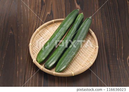 Fresh cucumbers in a colander Fresh cucumbers in a colander 116636023