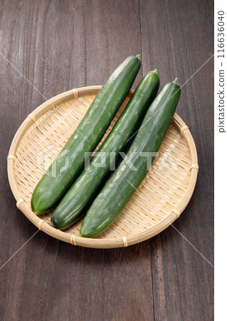 Fresh cucumbers in a colander Fresh cucumbers in a colander 116636040