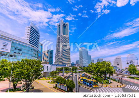 Yokohama cityscape in Japan: A view of the Minato Mirai area, including Yokohama Landmark Tower under the summer sky from Sakuragicho Station Yokohama cityscape in Japan: A view of the Minato Mirai area, including Yokohama Landmark Tower under the summer sky from Sakuragicho Station 116637531
