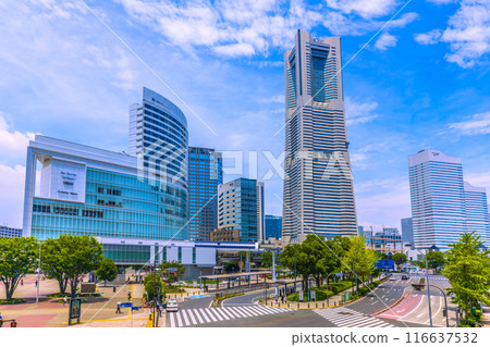 Yokohama cityscape in Japan: A view of the Minato Mirai area, including Yokohama Landmark Tower under the summer sky from Sakuragicho Station Yokohama cityscape in Japan: A view of the Minato Mirai area, including Yokohama Landmark Tower under the summer sky from Sakuragicho Station 116637532