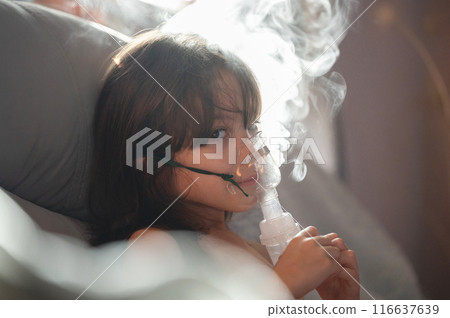 Child girl hold nebuliser Child girl hold nebuliser 116637639