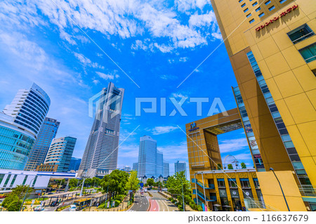 Yokohama cityscape in Japan: A view of the Minato Mirai area, including Yokohama Landmark Tower under the summer sky from Sakuragicho Station Yokohama cityscape in Japan: A view of the Minato Mirai area, including Yokohama Landmark Tower under the summer sky from Sakuragicho Station 116637679