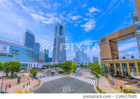Yokohama cityscape in Japan: A view of the Minato Mirai area, including Yokohama Landmark Tower under the summer sky from Sakuragicho Station Yokohama cityscape in Japan: A view of the Minato Mirai area, including Yokohama Landmark Tower under the summer sky from Sakuragicho Station 116637680