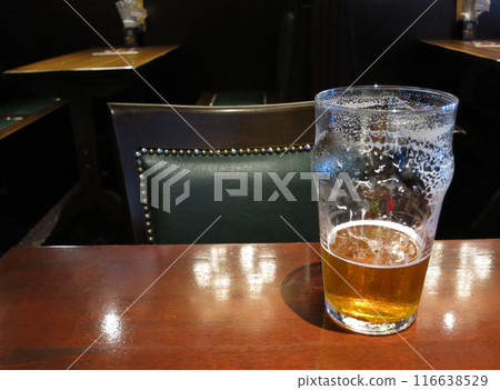Drinking beer (ale) in an English pub Drinking beer (ale) in an English pub 116638529