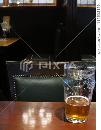 Drinking beer (ale) in an English pub Drinking beer (ale) in an English pub 116638536