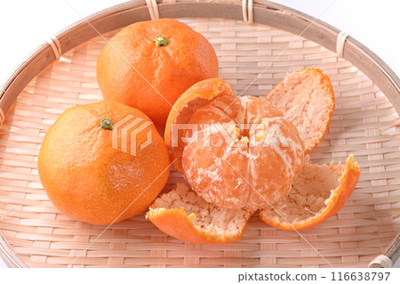 Peeled house mandarins on bamboo basket white background Peeled house mandarins on bamboo basket white background 116638797