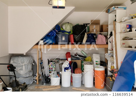 A typical household garage filled with miscellaneous items A typical household garage filled with miscellaneous items 116639514