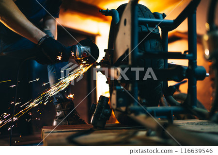 Motorcycle repair. Young man repairing motorbike in garage. Mechanic fixing motorcycle engine. Motorcycle repair. Young man repairing motorbike in garage. Mechanic fixing motorcycle engine. 116639546