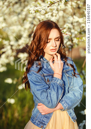 Portrait of a beautiful bride. Wedding concept. Stylish wedding. Great sunset light. Spring garden. 116640187