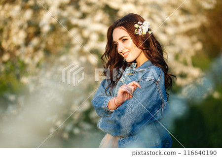 Portrait of a beautiful bride. Wedding concept. Stylish wedding. Great sunset light. Spring garden. 116640190