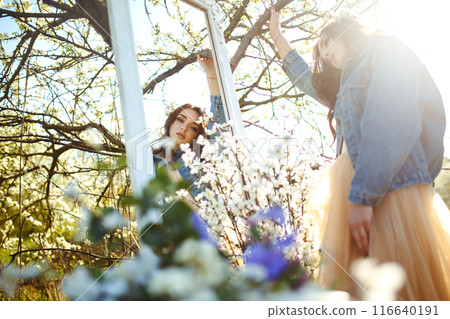 Portrait of a beautiful bride. Wedding concept. Stylish wedding. Great sunset light. Spring garden. 116640191