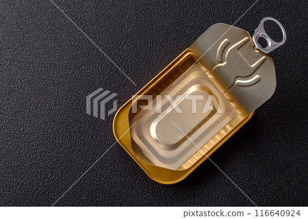 Metal aluminum opened can of canned sardines in oil with spices and salt 116640924