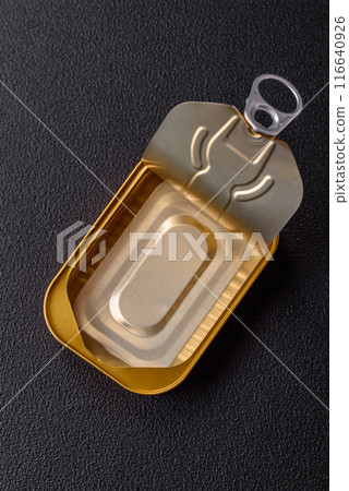 Metal aluminum opened can of canned sardines in oil with spices and salt 116640926