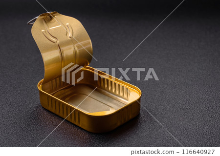 Metal aluminum opened can of canned sardines in oil with spices and salt 116640927