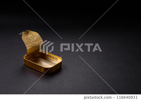 Metal aluminum opened can of canned sardines in oil with spices and salt 116640931