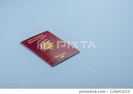 Passport of the Republic of France on a blue background Passport of the Republic of France on a blue background 116641010