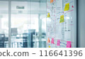 Whiteboard Full of Colorful Sticky Notes in Dynamic Work Environment 116641396