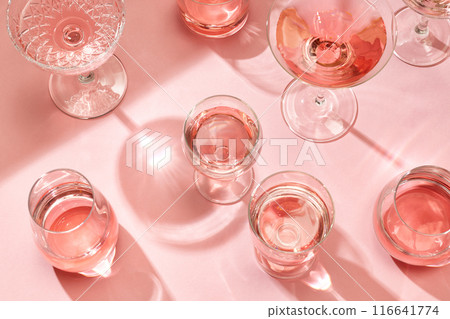 various glasses on pink background 116641774