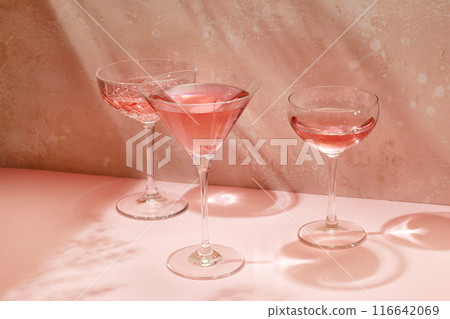 various glasses on pink background 116642069