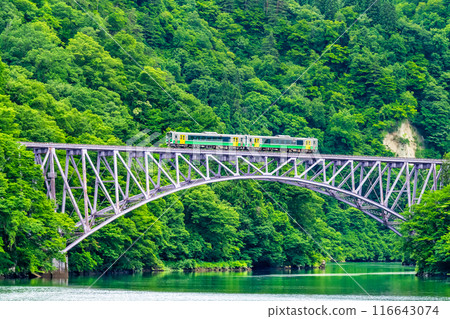 Fukushima Tadami Line: A train crossing the First Tadami River Bridge in summer 116643074
