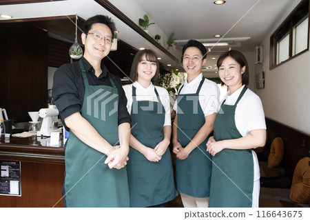 Four smiling cafe staff members Four smiling cafe staff members 116643675
