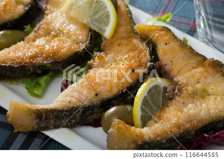 Slices of fried in flour sturgeon Slices of fried in flour sturgeon 116644585