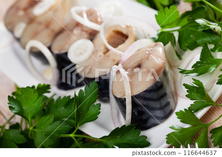 Marinated mackerel with sliced onion and parsley 116644637