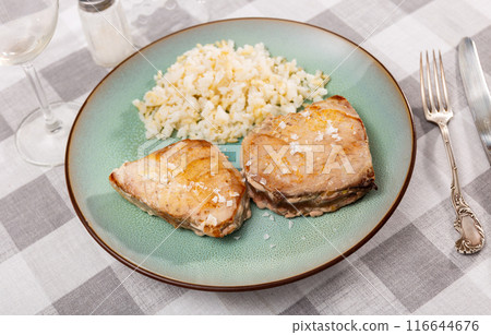 Portion of just cooked tuna fillet with rice 116644676