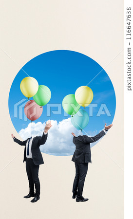 Two men are holding balloons in their hands, one of which is wearing a tie Two men are holding balloons in their hands, one of which is wearing a tie 116647638