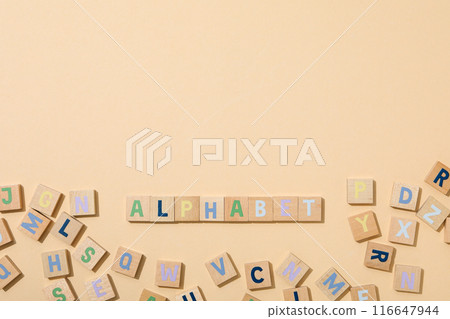 Alphabet from three-dimensional letters, top view. 116647944