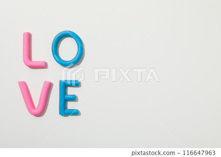 The word "love" is made of colored plasticine on a white background. 116647963