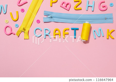 The word "craft" is made of colored plasticine, laid out on a pink background. 116647964