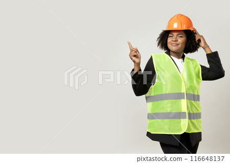 A young girl in the form of a construction worker with a hard hat A young girl in the form of a construction worker with a hard hat 116648137